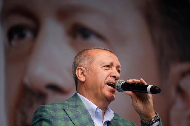 Turkish President Tayyip Erdogan addresses his supporters during an election rally in Istanbul