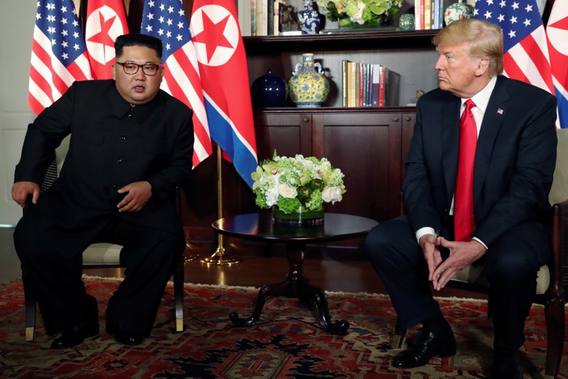 U.S. President Trump and North Korea's Kim meet at the start of their summit in Singapore