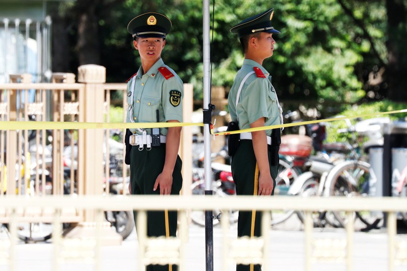 Paramilitary policemen take position near Beijing's Tiananmen Square