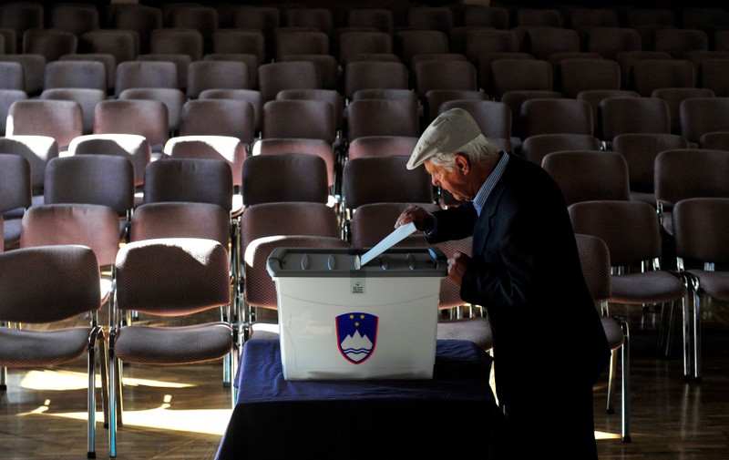 A man casts his vote at a polling station during the general election in Vodice