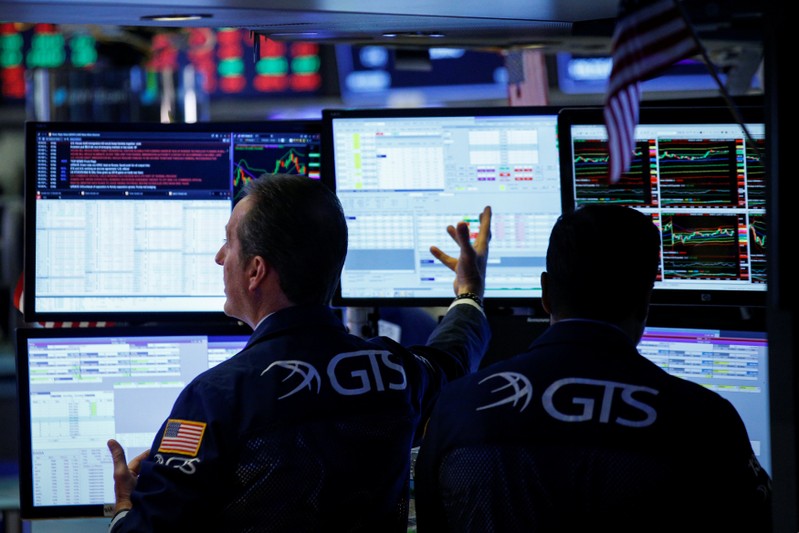 Traders work on the floor of the NYSE in New York