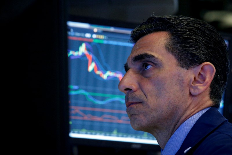 Traders work on the floor of the NYSE in New York