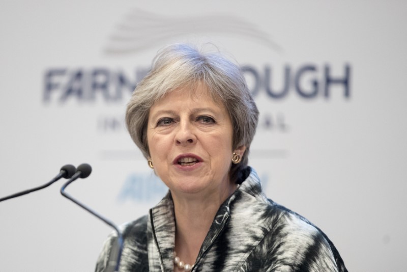 Britain's Prime Minister, Theresa May speaks at the Farnborough Airshow, in Farnborough