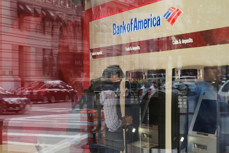 FILE PHOTO: Customer uses an ATM at a Bank of America branch in Boston