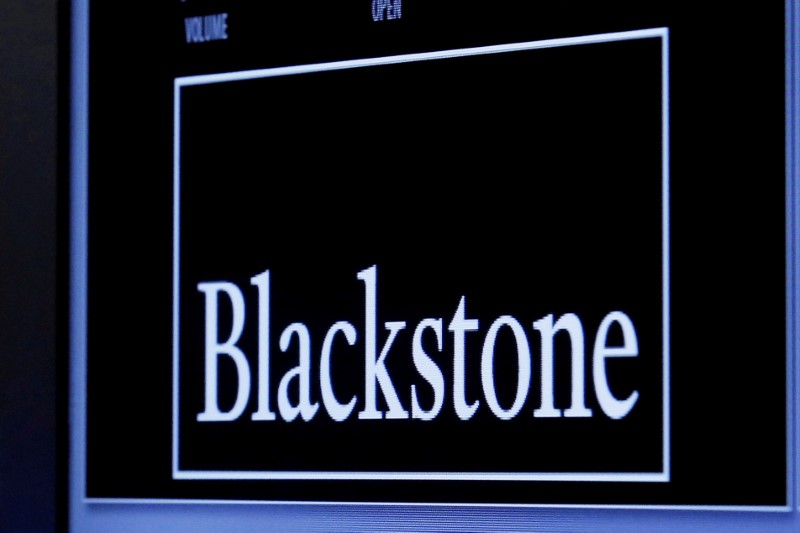 FILE PHOTO - The logo of Blackstone Group is displayed at the post where it is traded on the floor of the New York Stock Exchange