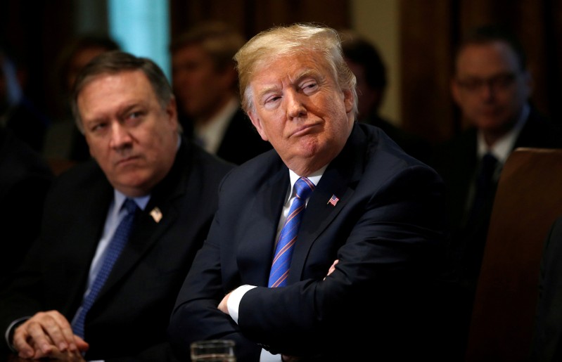 U.S. Secretary of State Pompeo and President Trump listen during cabinet meeting at the White House in Washington