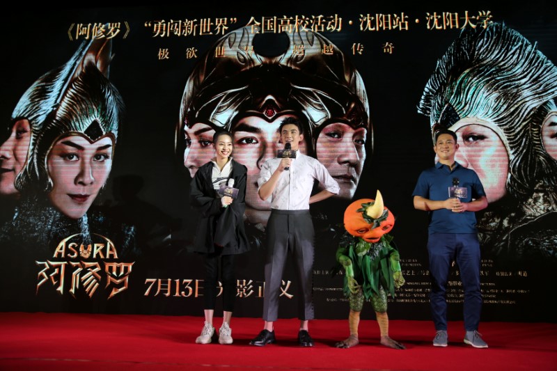 Director Zhang Peng and actors Wu Lei and Zhang Yishang attend a promotional event for the movie 