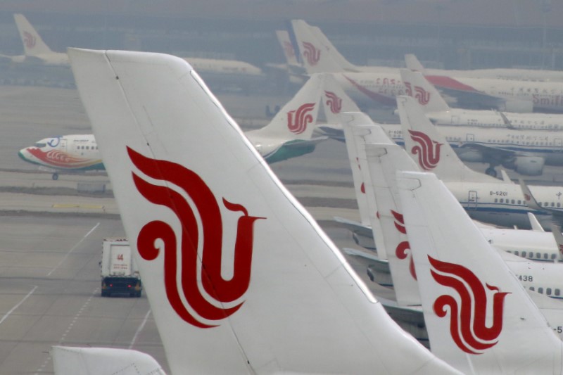 FILE PHOTO - Flights of Air China are parked on the tarmac of Beijing Capital International Airport in Beijing