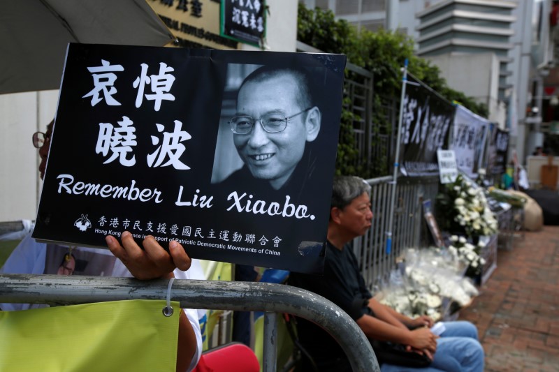 FILE PHOTO - Pro-democracy activists mourn the death of Nobel Laureate Liu Xiaobo in Hong Kong