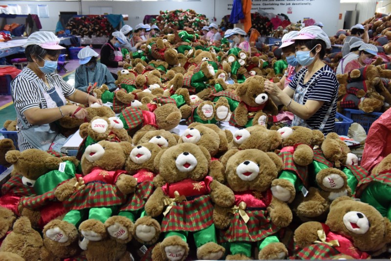 Workers make stuffed toys for export inside a factory in Linyi, Shandong