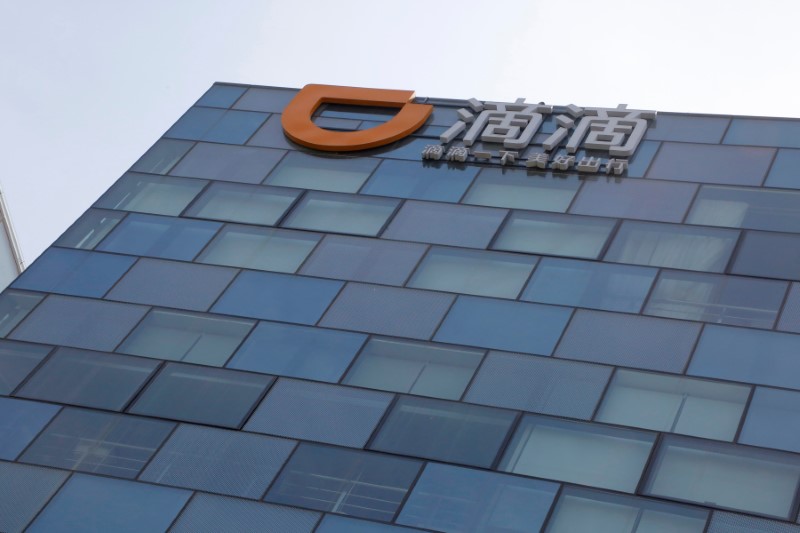 FILE PHOTO: Logo of Didi Chuxing is seen at its headquarters building in Beijing
