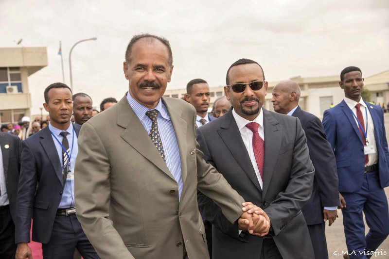 Eritrean President Isaias Afwerki and Ethiopia's Prime Minister Abiy Ahmed and walk together at Asmara International Airport