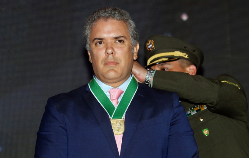 Colombia's President-elect Ivan Duque, is decorated with the 