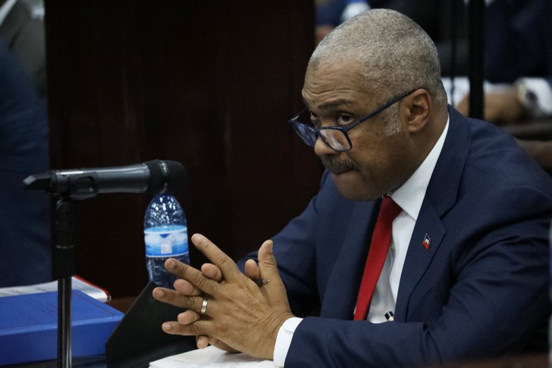 Haitian Prime minister Jack Guy Lafontant gestures during a meeting with members of the Parliament in Port-au-Prince