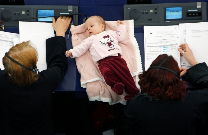 FILE PHOTO: Denmark's member of the European Parliament Hanne Dahl and her baby attend a voting session at the European Parliament in Strasbourg