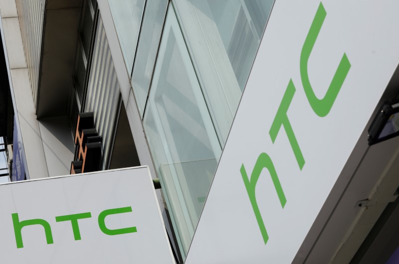 Logos of HTC are seen outside its store in Taipei
