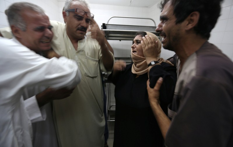 The mother of a Palestinian who was killed by Israeli troops east of Khan Younis reacts at hospital in Gaza Strip