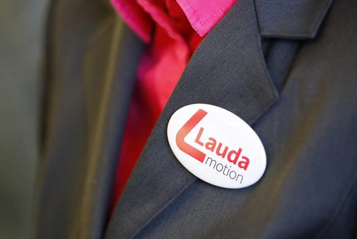 A button with the Laudamotion logo is seen at a flight attendant's jacket in Duesseldorf