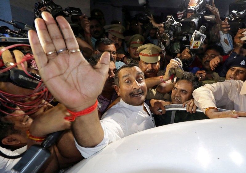 FILE PHOTO: Kuldeep Singh Sengar, a legislator of Uttar Pradesh state from India's ruling BJP, reacts as he leaves a court after he was arrested on Friday in connection with the rape of a teenager, in Lucknow