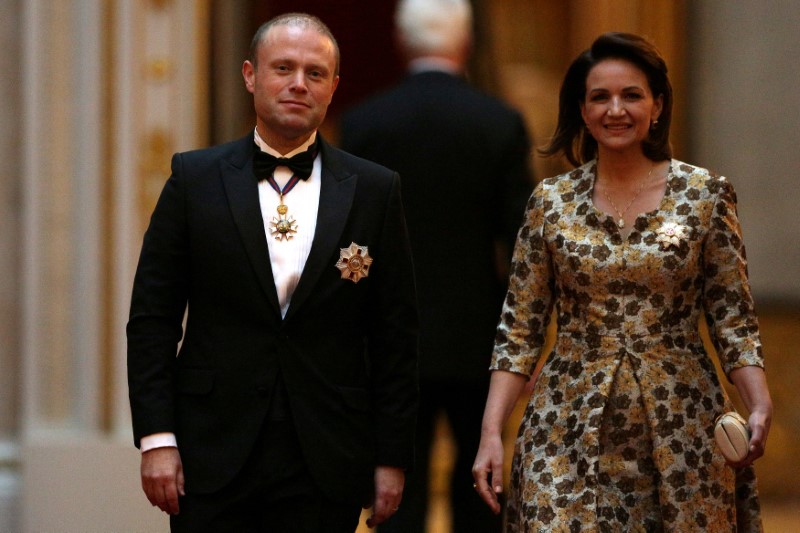 FILE PHOTO: Malta's Prime Minister Joseph Muscat and his wife Michelle arrive to attend The Queen's Dinner during The Commonwealth Heads of Government Meeting (CHOGM), at Buckingham Palace in London