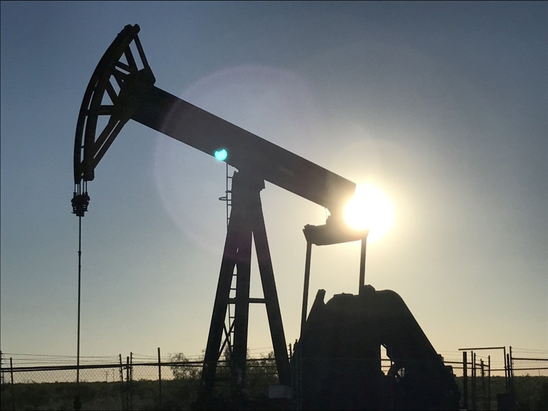 FILE PHOTO: An oil pump jack at sunset near Midland Texas