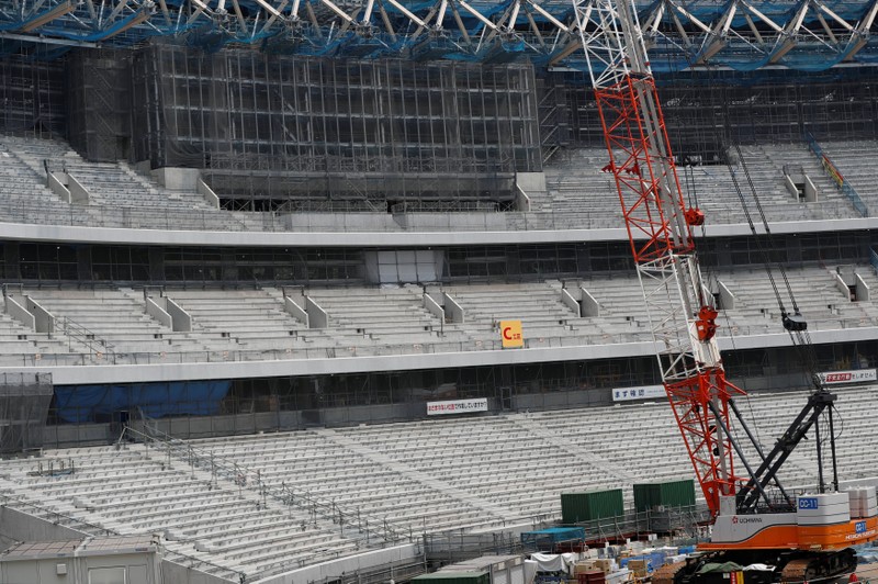 FILE PHOTO: Part of the public seating area and a huge screen are seen at the construction site of the New National Stadium, the main stadium of Tokyo 2020 Olympics and Paralympics in Tokyo