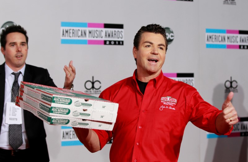 FILE PHOTO: John Schnatter, founder and CEO of Papa John's Pizza, arrives at the 2011 American Music Awards in Los Angeles