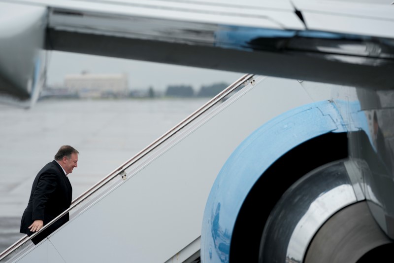 U.S. Secretary of State Mike Pompeo boards his plane at Yokota Air Force Base in Fussa, Japan, for a refueling stop on his way to Pyongyang