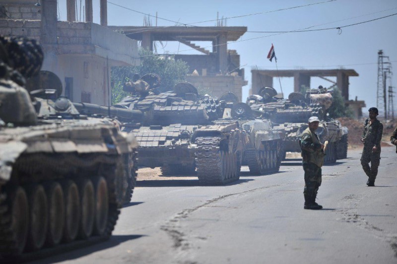 Forces loyal to Syria's President Bashar al-Assad are deployed in al-Ghariya al-Gharbiya in Deraa province