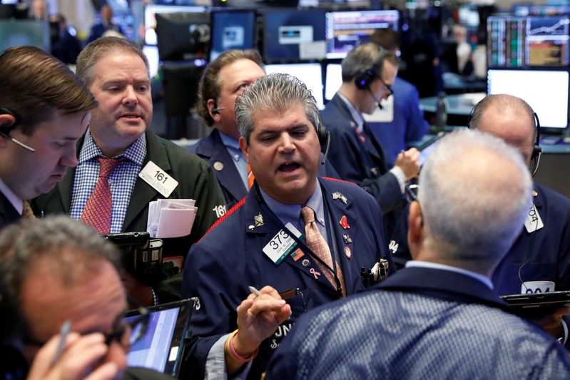 Traders work on the floor of the NYSE in New York