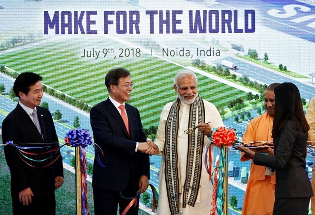 South Korean President Moon Jae-in and Indian Prime Minister Narendra Modi shake hands after inaugurating the Samsung Electronics smartphone manufacturing facility in Noida