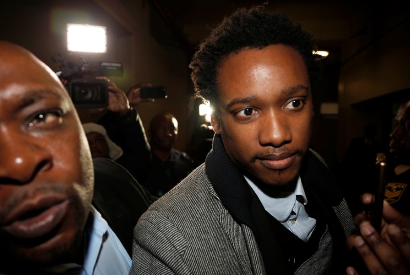 Duduzane Zuma, the son of scandal-plagued former South African president Jacob Zuma, arrives in court ahead of being charged with corruption, in Johannesburg