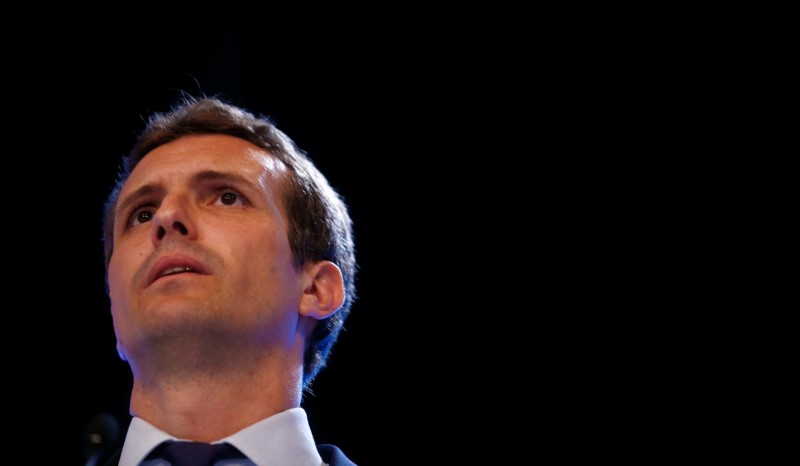 Pablo Casado reacts after being elected as the new leader of Spain's conservative People's Party in Madrid