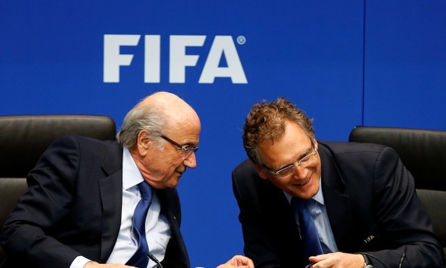 FILE PHOTO: Sepp Blatter talks to FIFA Secretary General Valcke during a news conference in Zurich