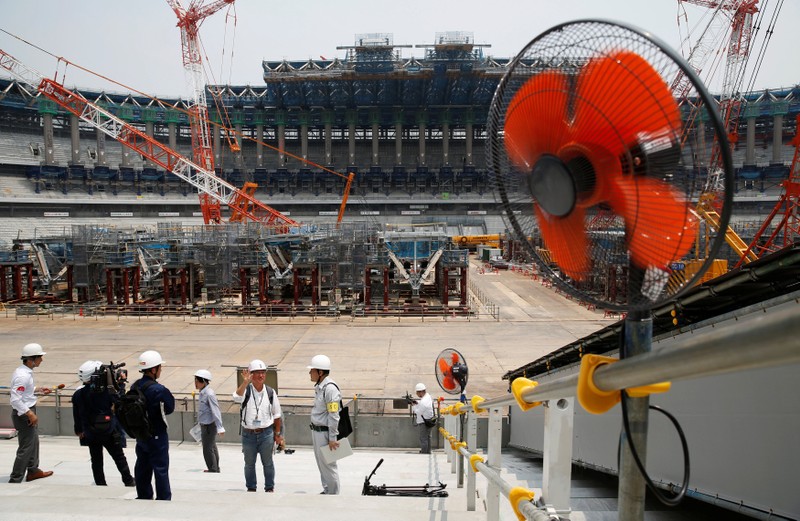 Electrical fans are seen during a heat wave, at the construction site of the New National Stadium, the main stadium of the Tokyo 2020 Olympics and Paralympics, during a media opportunity in Tokyo