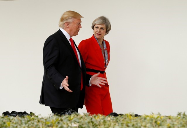 FILE PHOTO: U.S. President Donald Trump escorts British Prime Minister Theresa May down the White House colonnade after their meeting at the White House in Washington