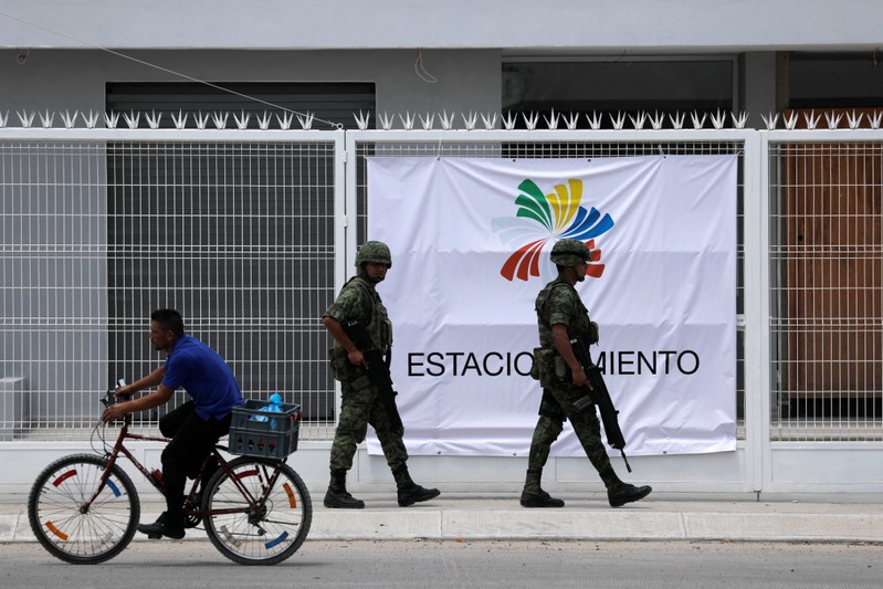 Soldiers guard the outside of the convention centre were the 13th Pacific Alliance Summit will take place in Puerto Vallarta