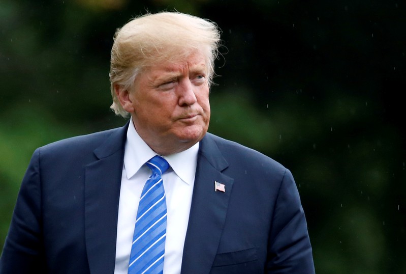 U.S. President Donald Trump walks from Marine One as he returns from Kansas City Missouri to the White House in Washington