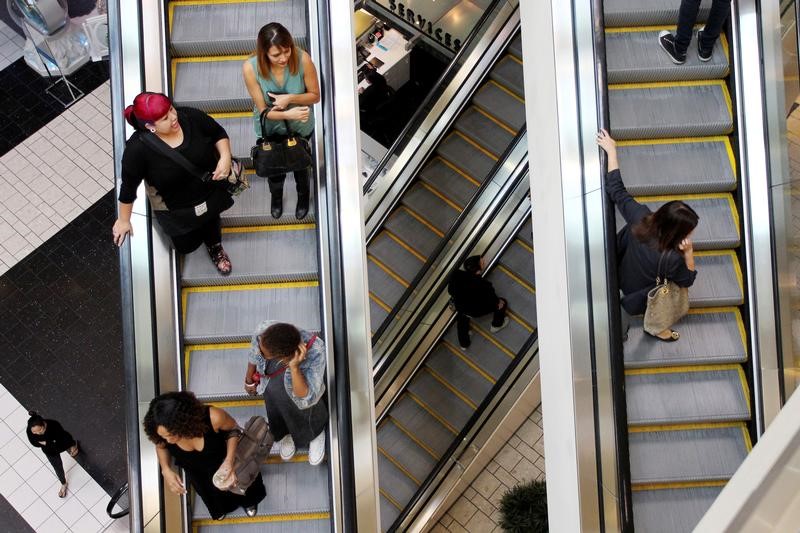 FILE PHOTO: Shoppers ride escalators at the Beverly Center mall in Los Angeles