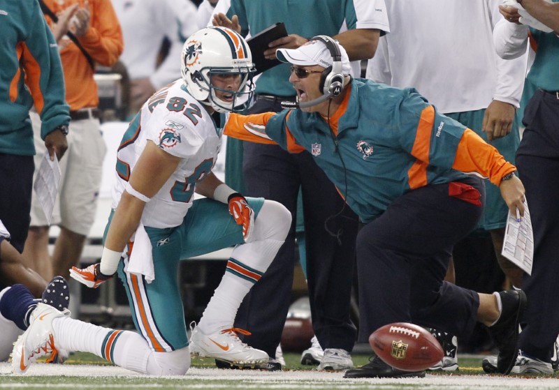 Dolphins head coach Sparano congratulates wide receiver Hartline after he made a catch against the Cowboys in Arlington, Texas