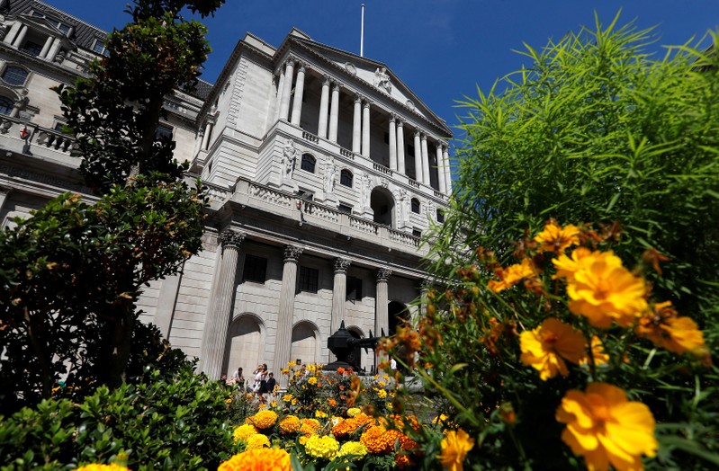 Flowers in bloom are seen opposite the Bank of England, in London