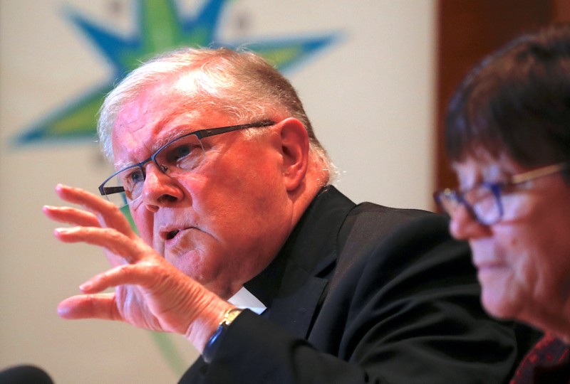 Archbishop Mark Coleridge, President of the Australian Catholic Bishops Conference in Australia, speaks as Sister Monica Cavanagh, President of Catholic Religious Australia, listens during a media conference in Sydney