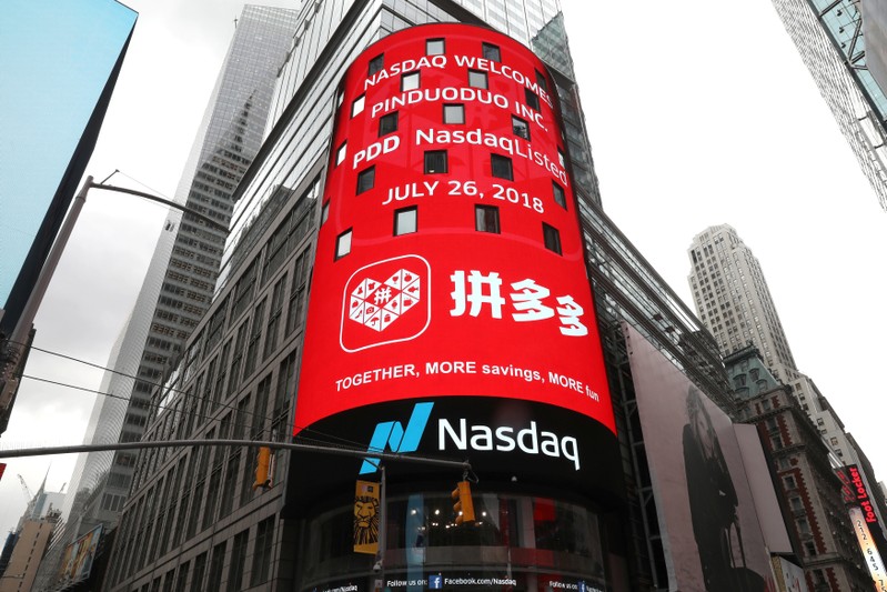 FILE PHOTO: A display at the Nasdaq Market Site shows a message after Chinese online group discounter Pinduoduo Inc. (PDD) was listed on the Nasdaq exchange in Times Square in New York City