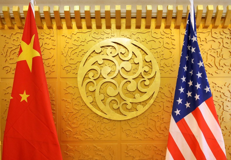 FILE PHOTO: Chinese and U.S. flags are set up for a meeting during a visit by U.S. Secretary of Transportation Elaine Chao at China's Ministry of Transport in Beijing