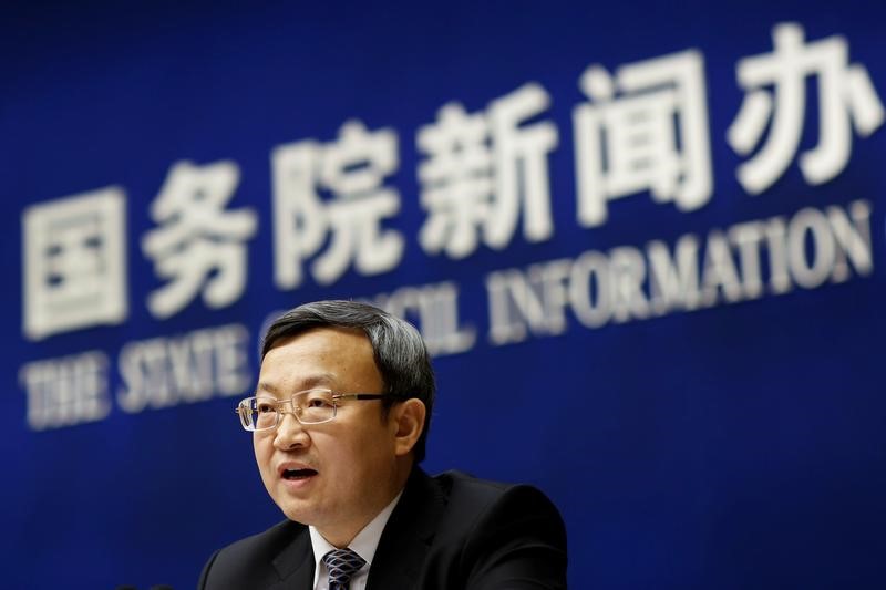 FILE PHOTO - Chinese Vice Commerce Minister and Deputy China International Trade Representative Wang Shouwen attends a news conference in Beijing