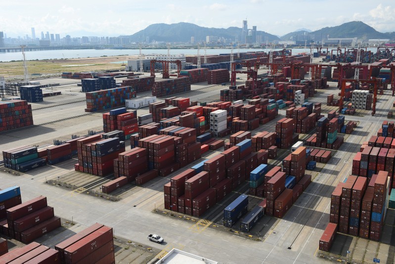 Shipping containers are seen stacked at the Dachan Bay Terminals in Shenzhen