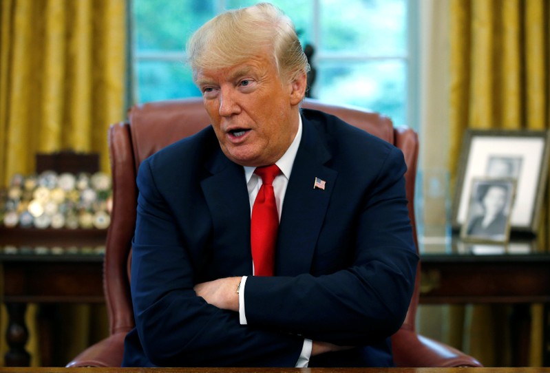 U.S. President Trump answers question during interview with Reuters in the Oval Office of the White House in Washington