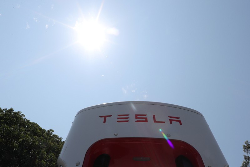 FILE PHOTO: A Tesla electric car supercharger station is seen in Los Angeles