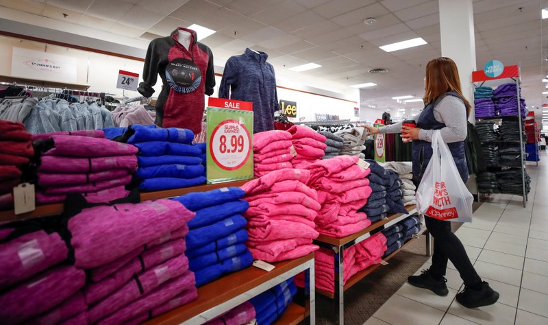 FILE PHOTO: A shopper checks on merchandise at the J.C. Penney department store in North Riverside