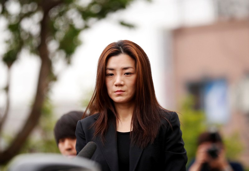 FILE PHOTO - Cho Hyun-min, a former Korean Air senior executive and the younger daughter of the airline's chairman Cho Yang-ho, arrives at a police station in Seoul